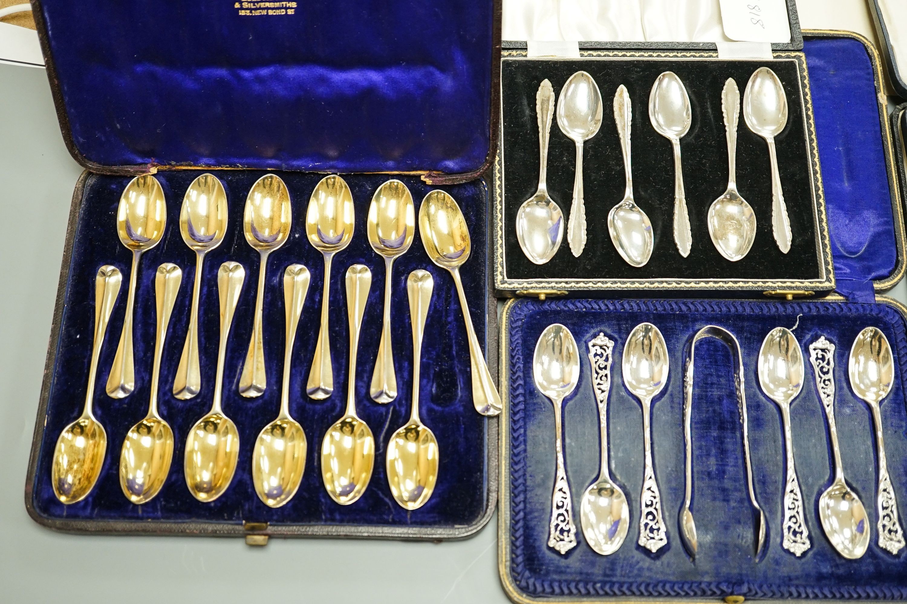 Seven assorted cased sets of English silver tea and coffee spoons, including a set of twelve silver gilt teaspoons, London, 1882 (one set incomplete).
